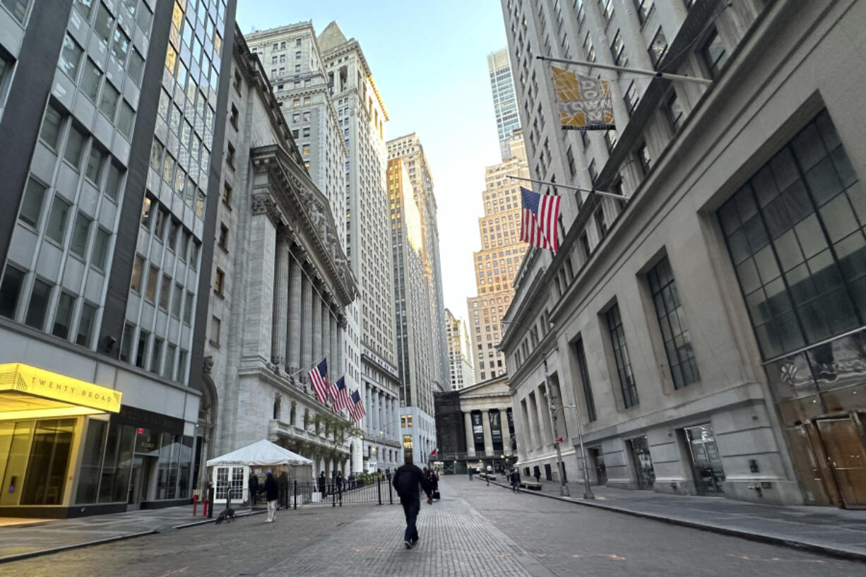 FILE - American flags hang from the New York Stock Exchange, at left, on Oct. 16, 2024, in New York.