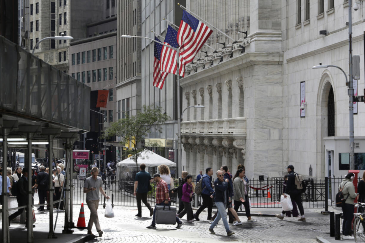 FILE - People pass the New York Stock Exchange on Oct. 1, 2024, in New York.