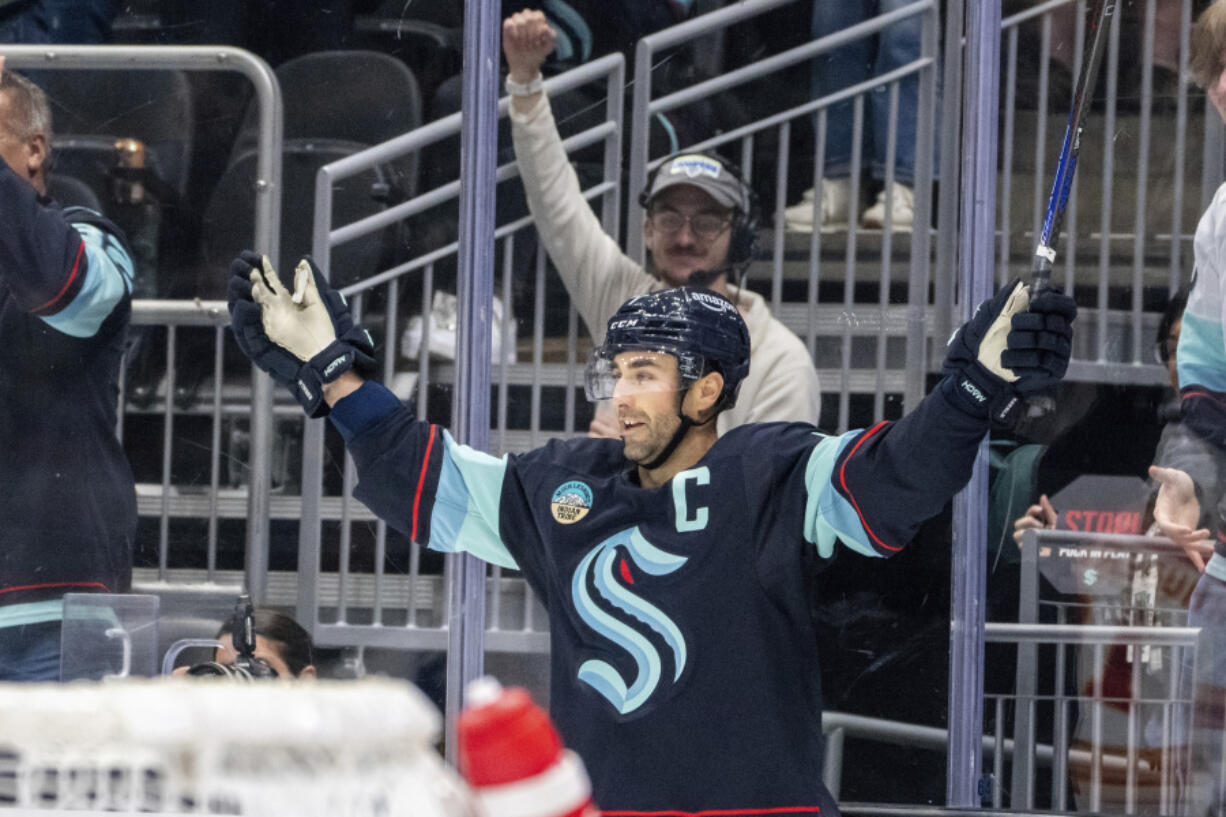 Seattle Kraken forward Jordan Eberle celebrates after scoring a goal in overtime of an NHL hockey game against the Calgary Flames, Saturday, Oct. 19, 2024, in Seattle.