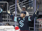 Seattle Kraken forward Jordan Eberle celebrates after scoring a goal in overtime of an NHL hockey game against the Calgary Flames, Saturday, Oct. 19, 2024, in Seattle.