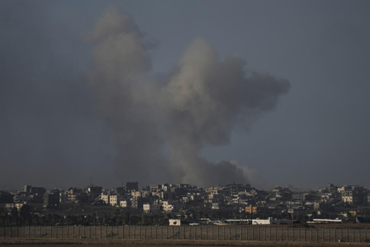 File - Smoke rises following Israeli bombardment on the Gaza Strip, as seen from southern Israel, Sunday, Oct. 20, 2024.