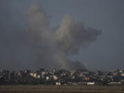 File - Smoke rises following Israeli bombardment on the Gaza Strip, as seen from southern Israel, Sunday, Oct. 20, 2024.