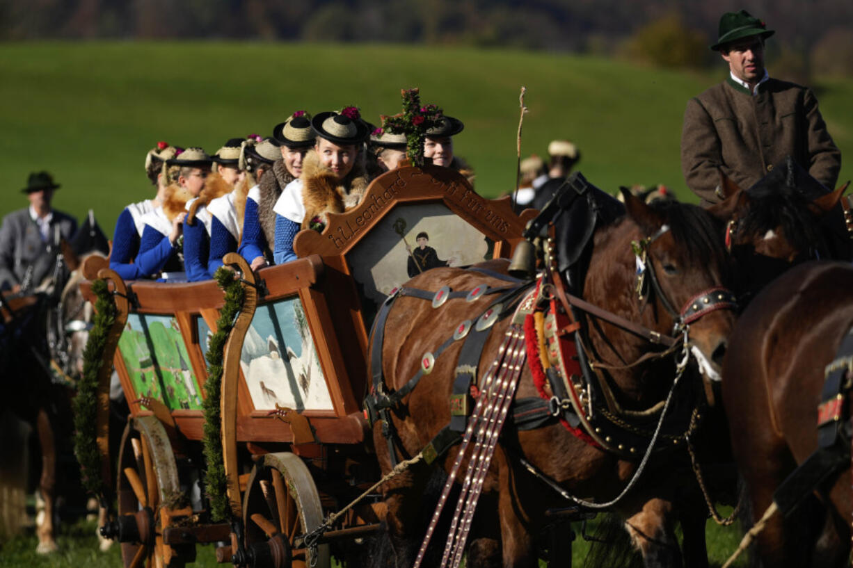 Women in traditional costumes of the region take part at the Leonhardi pilgrimage Oct. 27 in Warngau near Munich, Germany.