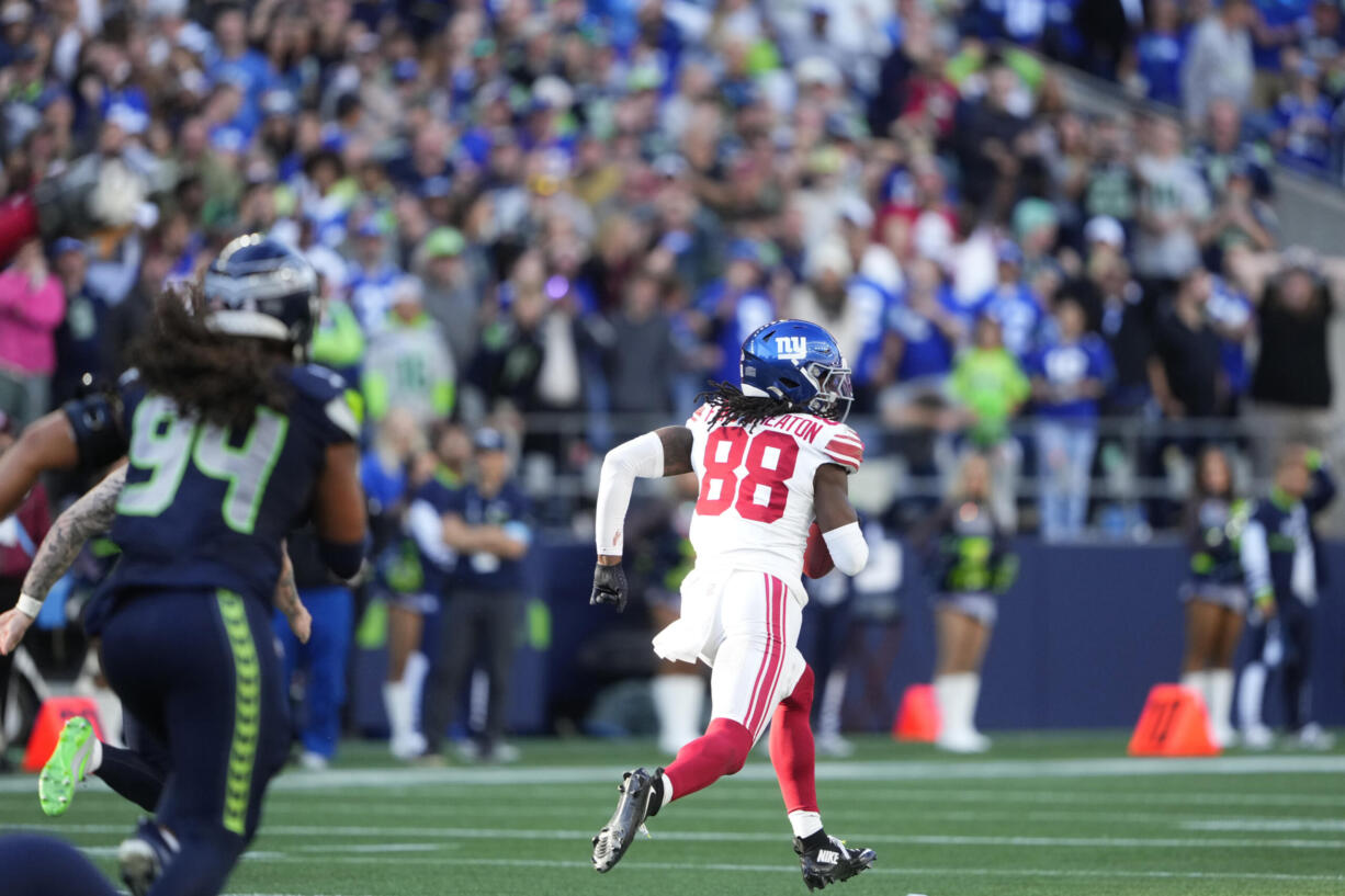 New York Giants wide receiver Bryce Ford-Wheaton (88) runs for a touchdown after a Seattle Seahawks blocked field goal attempt during the second half of an NFL football game, Sunday, Oct. 6, 2024, in Seattle.