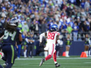 New York Giants wide receiver Bryce Ford-Wheaton (88) runs for a touchdown after a Seattle Seahawks blocked field goal attempt during the second half of an NFL football game, Sunday, Oct. 6, 2024, in Seattle.