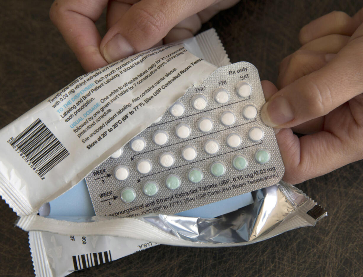 FILE - A one-month dosage of hormonal birth control pills is displayed in Sacramento, Calif., Aug. 26, 2016.