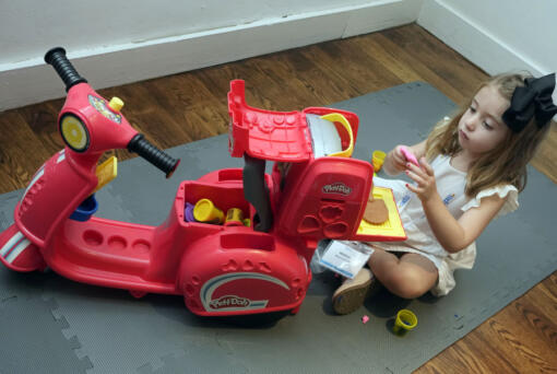 Madison Mangan, age 4 1/2, plays with a Play-Doh Pizza Scooter, from Hasbro, at the TTPM 2024 Holiday Showcase event, in New York, Tuesday, Sept. 17, 2024.