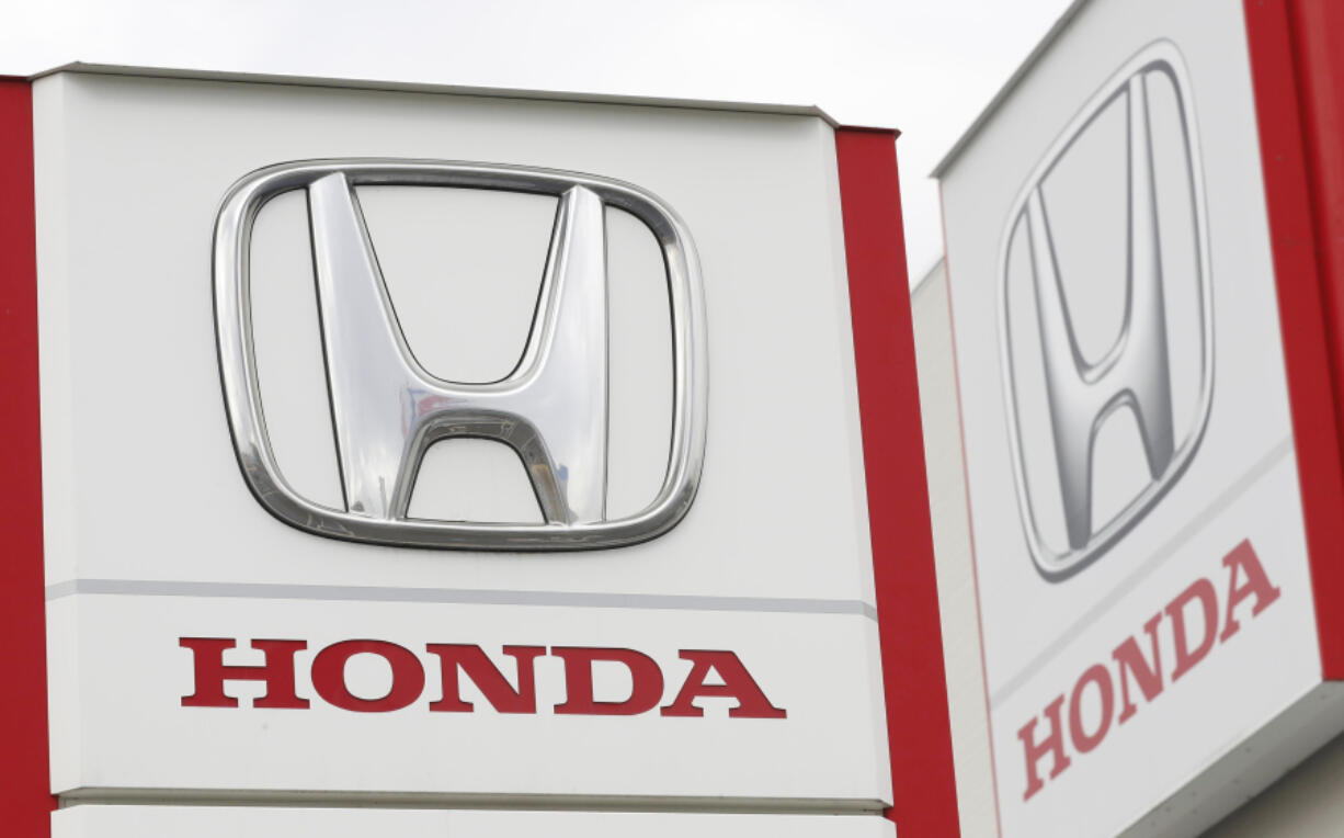 FILE - Logos of Honda Motor Co. are pictured in Tsukuba, northeast of Tokyo, Feb. 13, 2019.