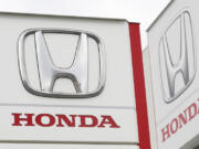 FILE - Logos of Honda Motor Co. are pictured in Tsukuba, northeast of Tokyo, Feb. 13, 2019.