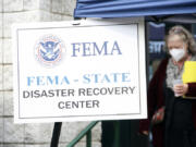 People gather at a FEMA Disaster Recovery Center at A.C. Reynolds High School in Asheville, N.C.,, Tuesday, Oct. 15, 2024.