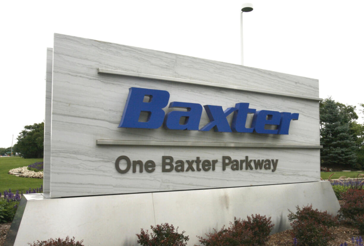 FILE - The sign outside Baxter International Inc. is seen in Deerfield, Ill., July 2009.