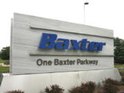 FILE - The sign outside Baxter International Inc. is seen in Deerfield, Ill., July 2009.