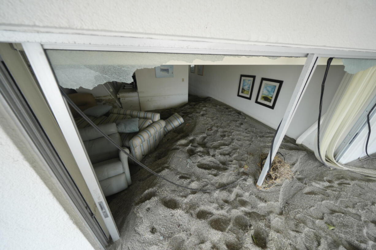 Several feet of sand fills a condo following the passage of Hurricane Milton, at YCA Vacation Rentals in Venice, Fla., Friday, Oct. 11, 2024.