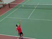 Leo Zhao of Camas serves to Aaron Li, also of Camas, during the 4A District 4 boys tennis singles final on Saturday, Oct. 26, 2024, at Club Green Meadows. Zhao won the marathon match 1-6, 6-0, 7-5 for his first district title.