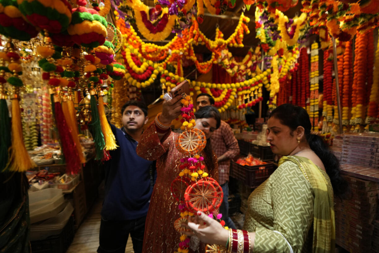 Women shop on the eve of Diwali, the Hindu festival of lights, in Jammu, India, Wednesday, Oct. 30, 2024.Diwali is one of Hinduism&rsquo;s most important festivals, dedicated to the worship of the goddess of wealth Lakshmi.