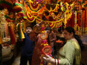 Women shop on the eve of Diwali, the Hindu festival of lights, in Jammu, India, Wednesday, Oct. 30, 2024.Diwali is one of Hinduism&rsquo;s most important festivals, dedicated to the worship of the goddess of wealth Lakshmi.