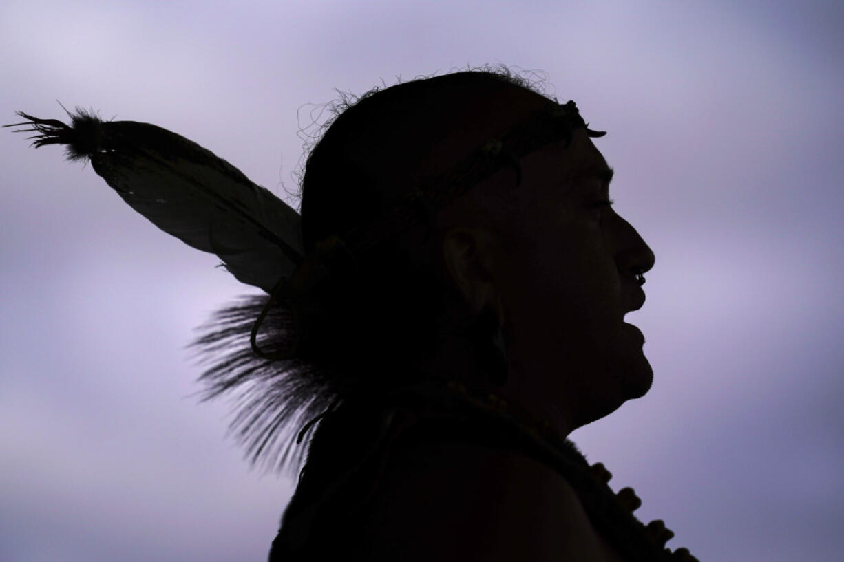 FILE - Tatanka Gibson of the Haliwa-Saponi/Nansemond Tribal Nations leads attendees in song and dance during a gathering marking Indigenous Peoples Day at Penn Treaty Park, Oct. 11, 2021, in Philadelphia.