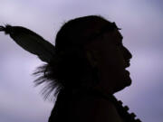 FILE - Tatanka Gibson of the Haliwa-Saponi/Nansemond Tribal Nations leads attendees in song and dance during a gathering marking Indigenous Peoples Day at Penn Treaty Park, Oct. 11, 2021, in Philadelphia.