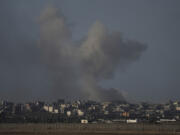 Smoke rises from the Gaza Strip following an Israeli bombardment Sunday.