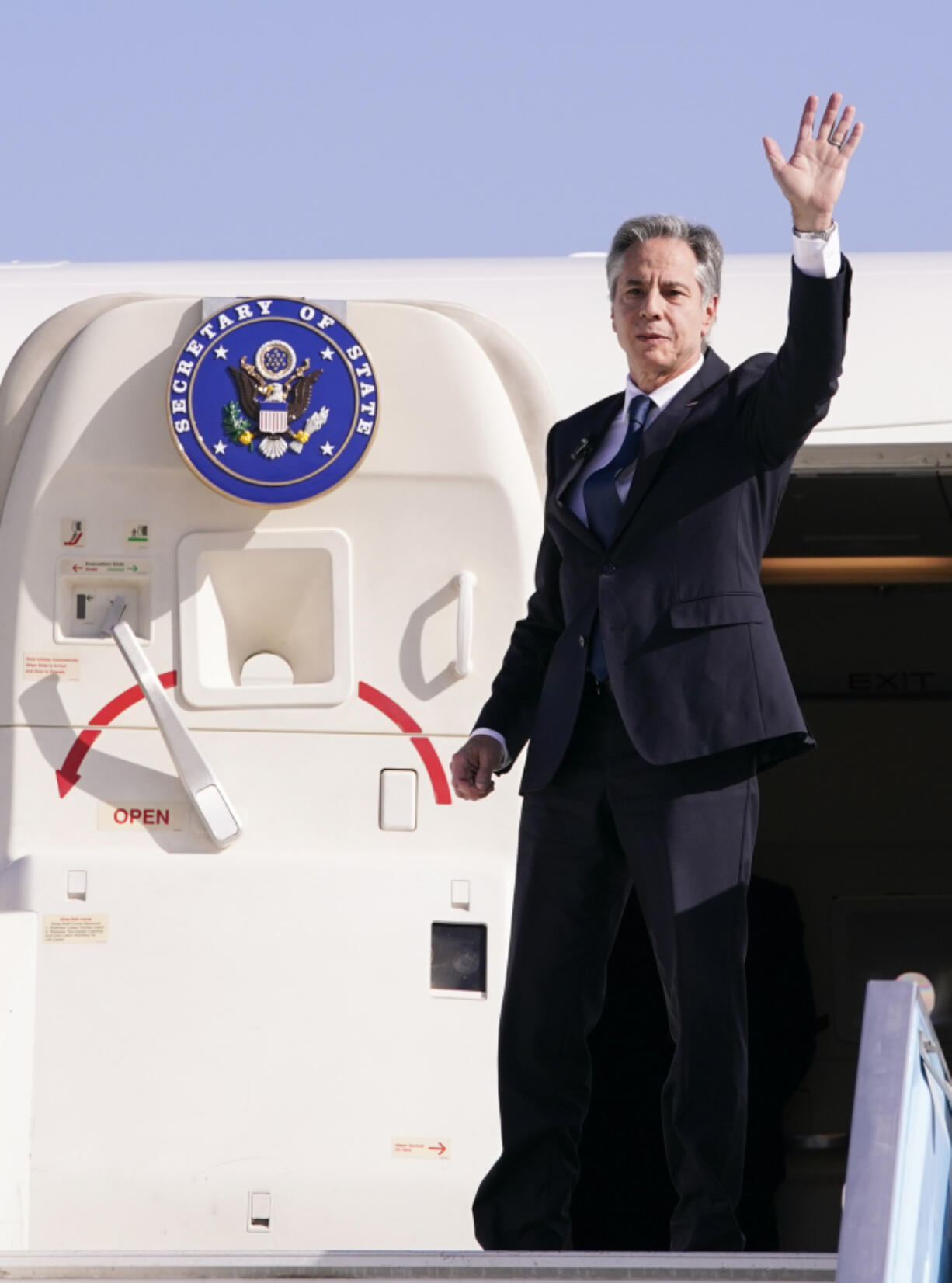 U.S. Secretary of State Antony Blinken waves as he departs for Riyadh, Saudi Arabia, from Ben Gurion International Airport in Tel Aviv, Israel, Wednesday, Oct. 23, 2024.