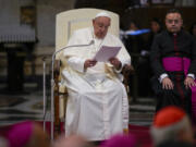 Pope Francis attends a prayer for peace Sunday at Rome&rsquo;s St. Mary Major Basilica.