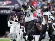 Jacksonville Jaguars defensive tackle Roy Robertson-Harris (95) celebrates after making a tackle during the first half of an NFL football game against the Houston Texans, Sunday, Sept. 29, 2024, in Houston.