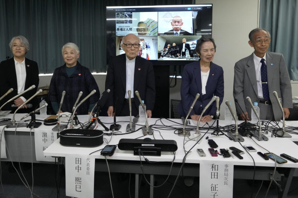 Terumi Tanaka, center, co-chairperson of Nihon Hidankyo and other senior members attend a press conference in Tokyo, Saturday, Oct. 12, 2024, a day after Nihon Hidankyo, an organization of survivors of the two U.S. atomic bombings, won the Nobel Peace Prize.