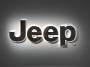 FILE - A Jeep logo is displayed at the North American International Auto Show in Detroit, Jan. 14, 2019.