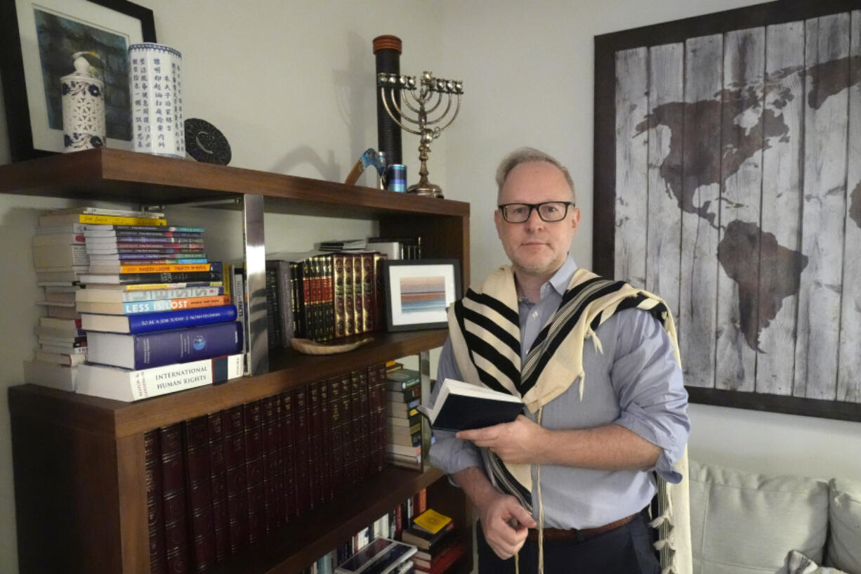 Daniel Gammerman stands Sept. 26 in his home in Miami, where he plans to worship privately during the Jewish High Holy Days.