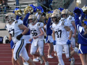 The members of the Kelso football team return to the field for the second half of their 3A Greater St. Helens League football game against Mountain View at McKenzie Stadium on Friday, Oct. 25, 2024.