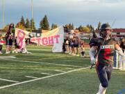 King's Way Christian football player Jace Barnes runs onto the field with a sword before the Knights' Class 1A Trico League game against Stevenson on Friday, Oct. 11, 2024.