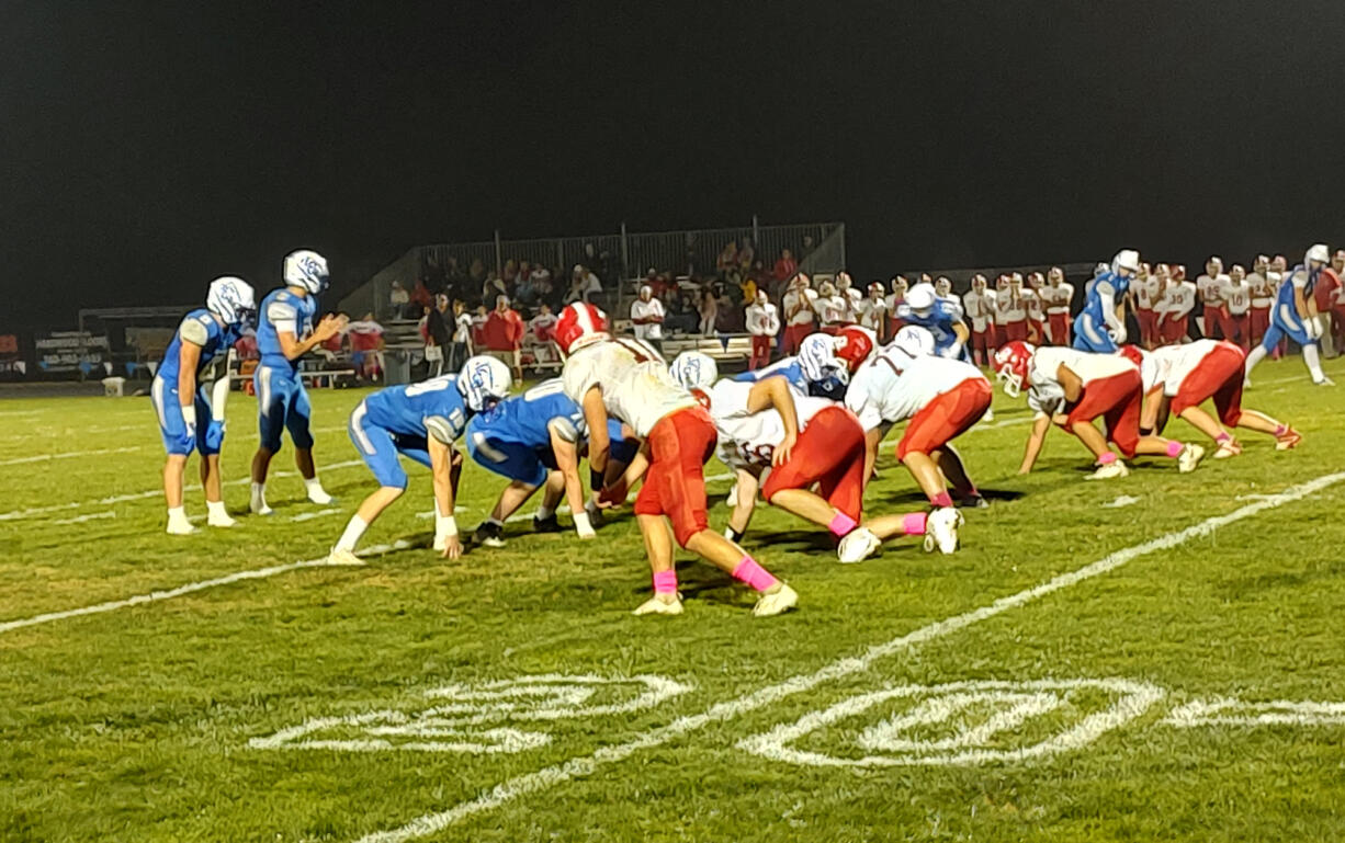 La Center quarterback Wyatt Eiesland awaits the snap with running back Isaac Chromey to his right in the Trico League game against Castle Rock on Friday, Oct. 4, 2024, at La Center.