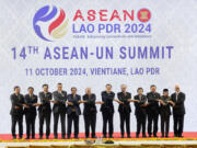 From left to right, Myanmar Foreign Ministry Permanent Secretary Aung Kyaw Moe, Philippine&rsquo;s President Ferdinand Marcos Jr., Singaporean Prime Minister Lawrence Wong, Thailand&rsquo;s Foreign Minister Maris Sangiampongsa, Vietnamese Prime Minister Pham Minh Chinh, U.N. Secretary-General Antonio Guterres, Laos&rsquo; Prime Minister Sonexay Siphandone, Malaysian Prime Minister Anwar Ibrahim, Brunei Sultan Hassanal Bolkiah, Cambodian Prime Minister Hun Manet, Indonesian Vice President Ma&rsquo;ruf Amin and East Timorese Prime Minister Xanana Gusmao hold hands during the 14th ASEAN-U.N. Summit in Vientiane, Laos, Friday, Oct. 11, 2024.