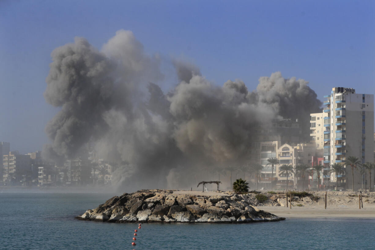 FILE - Smoke rises from buildings hit in Israeli airstrikes in Tyre, southern Lebanon, Monday, Oct. 28, 2024.