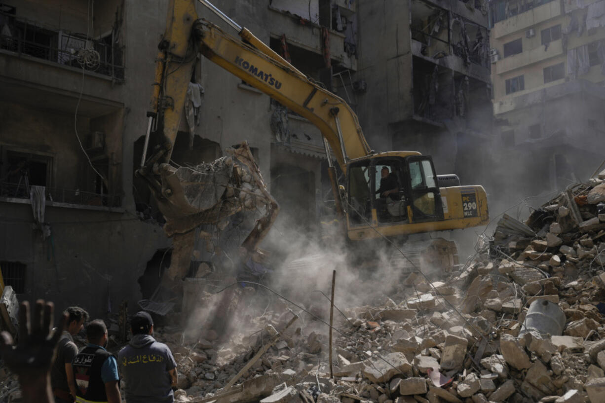 Rescue workers search for victims at the site of Thursday&rsquo;s Israeli airstrike in Beirut, Lebanon, Friday, Oct. 11, 2024.