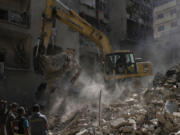 Rescue workers search for victims at the site of Thursday&rsquo;s Israeli airstrike in Beirut, Lebanon, Friday, Oct. 11, 2024.