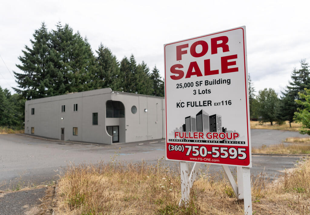 A for sale sign sits outside a vacant building on Northeast 94th Avenue in Vancouver in August. The building is a potential site for the City of Vancouver's 150-bed bridge shelter.