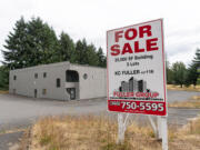 A for sale sign sits outside a vacant building on Northeast 94th Avenue in Vancouver in August. The building is a potential site for the City of Vancouver's 150-bed bridge shelter.