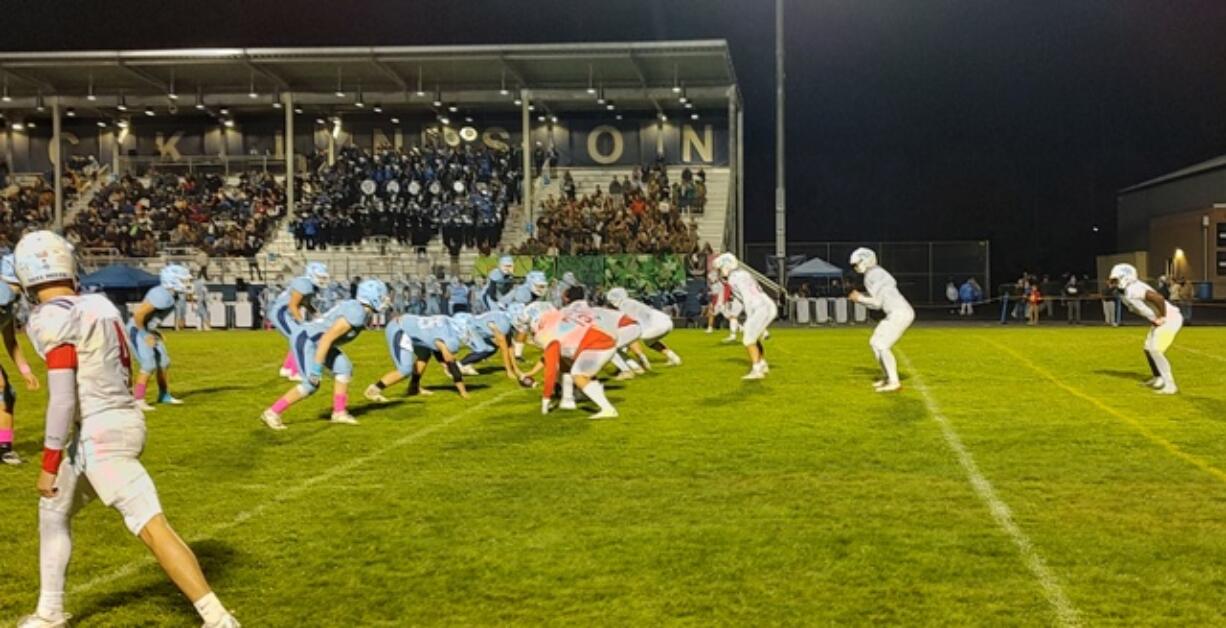 Mark Morris quarterback Carter Huhta, second from right, awaits the snap during the 2A Greater St. Helens League game on Friday, Oct. 18, 2024, a Hockinson. Mark Morris won the game 18-14.