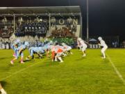 Mark Morris quarterback Carter Huhta, second from right, awaits the snap during the 2A Greater St. Helens League game on Friday, Oct. 18, 2024, a Hockinson. Mark Morris won the game 18-14.