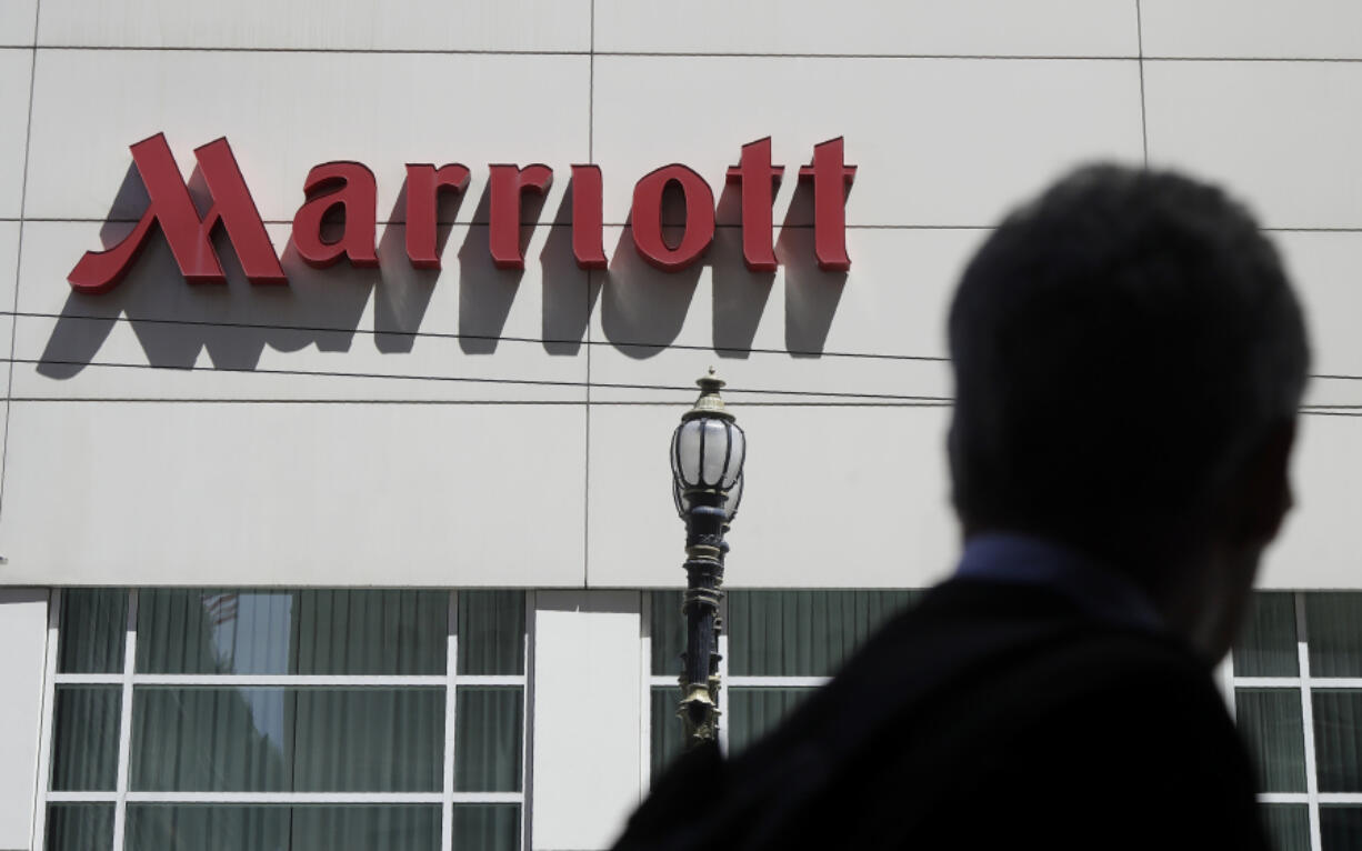 FILE - A person walks past the San Francisco Marriott Union Square hotel on July 11, 2019, in San Francisco.