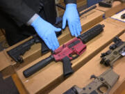 FILE &mdash; Ghost guns are displayed at the headquarters of the San Francisco Police Department, in San Francisco, Nov. 27, 2019.