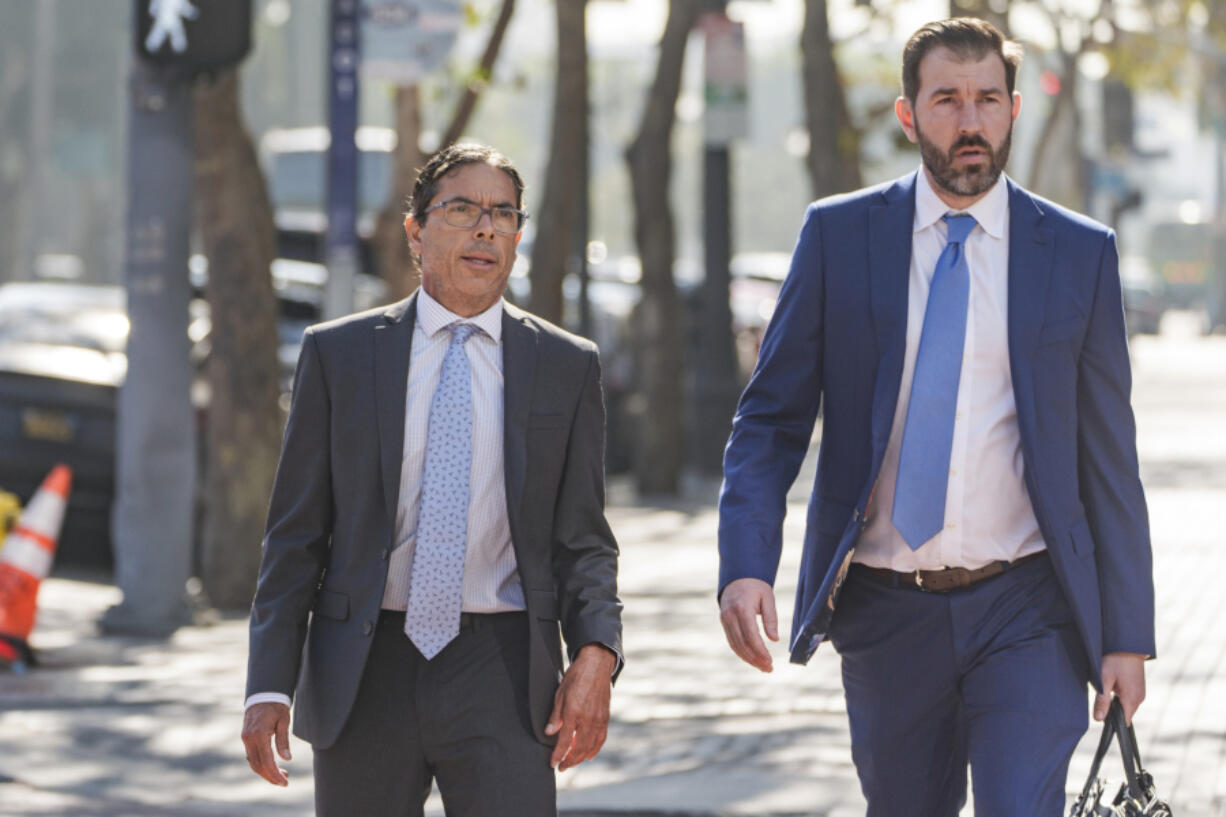 Dr. Mark Chavez, a physician from San Diego, left, who is charged in connection with actor Matthew Perry&#039;s death from an accidental ketamine overdose, with his criminal defense attorney Matthew Binninger arrive for a change of plea hearing at the United States Courthouse in Los Angeles, on Wednesday, Oct. 2, 2024.