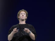 FILE - Mark Zuckerberg holds a pair of Orion AR glasses during the Meta Connect conferenceSept. 25, 2024, in Menlo Park, Calif. (AP Photo/Godofredo A.