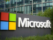 FILE - The Microsoft logo is displayed outside its French headquarters in Issy-les-Moulineaux, outside Paris, May 13, 2024.