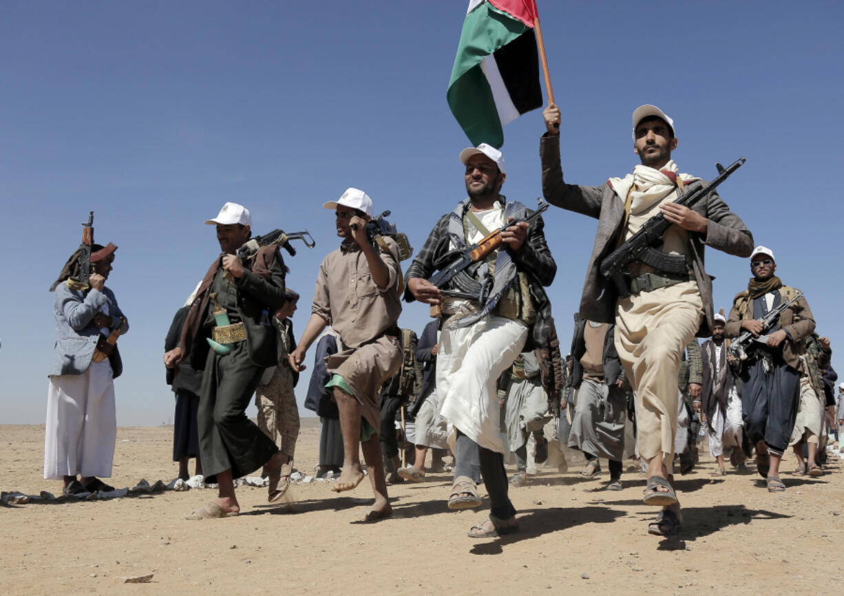 File - Houthi rebel fighters march during a rally of support for the Palestinians in the Gaza Strip and against the U.S. strikes on Yemen outside Sanaa on Jan. 22, 2024.