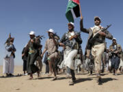 File - Houthi rebel fighters march during a rally of support for the Palestinians in the Gaza Strip and against the U.S. strikes on Yemen outside Sanaa on Jan. 22, 2024.