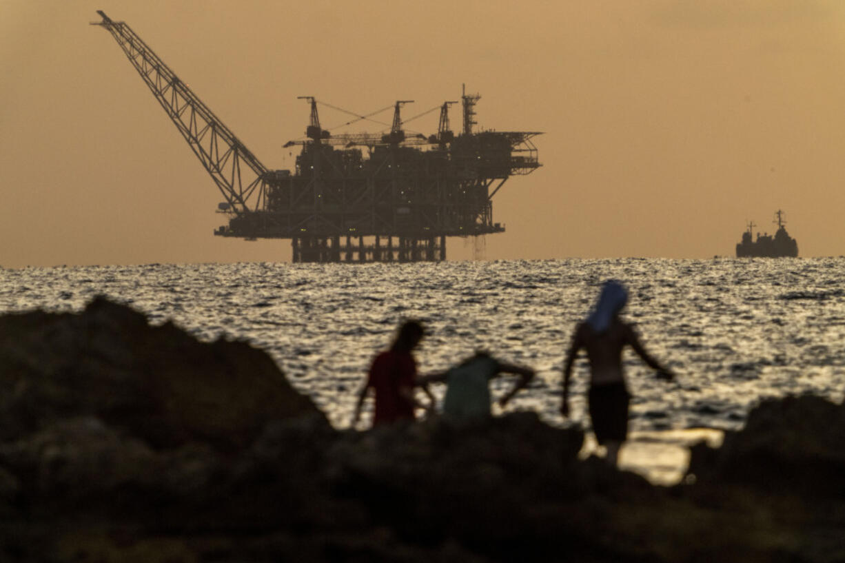 FILE - An oil platform in Israel&rsquo;s offshore Leviathan gas field is seen while an Israeli navy vessel patrols the Mediterranean Sea, Israel, on Sept. 20, 2024.