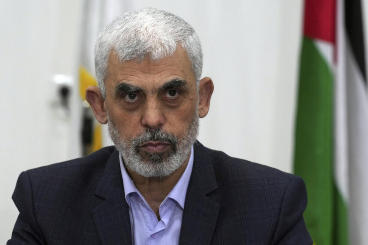 FILE - Yahya Sinwar, head of Hamas in Gaza, chairs a meeting with leaders of Palestinian factions at his office in Gaza City, on April 13, 2022.