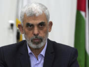 FILE - Yahya Sinwar, head of Hamas in Gaza, chairs a meeting with leaders of Palestinian factions at his office in Gaza City, on April 13, 2022.